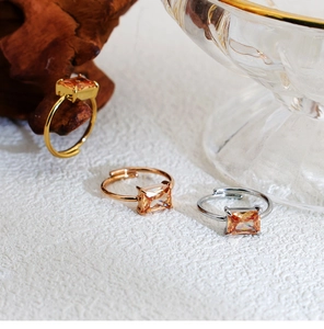 Three-color adjustable stainless steel rings featuring emerald-cut orange zircon stones
