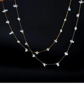 Detailed macro view of 18K gold plated chain with irregular moonstone and gold beads