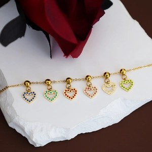 Gold stainless steel bracelet with six colorful zircon-encrusted hollow heart charms