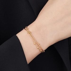 Minimalist double-layer snake chain bracelet with gold beads made of titanium steel