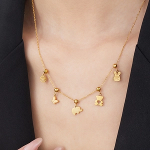 Gold stainless steel necklace with animal charms including elephant bear and rabbit