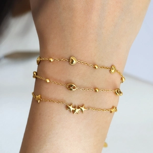 Three-piece 18K gold plated titanium steel bracelet set with heart, star, and oval link motifs