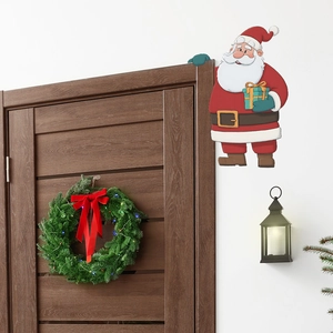 Adesivo murale Babbo Natale cartone animato con regalo per decorazione festiva