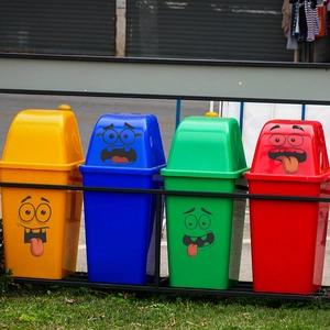Funny cartoon expression stickers on four colored waste bins for home cabinet decoration