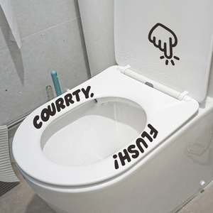 Minimalist black adhesive toilet stickers with COURRTY FLUSH text and finger gesture icon