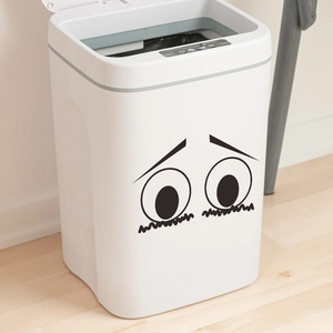 Smart white induction trash bin with cute cartoon eyes sticker for home decor