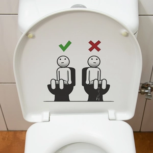 Creative toilet seat sticker showing correct and incorrect usage with cartoon icons