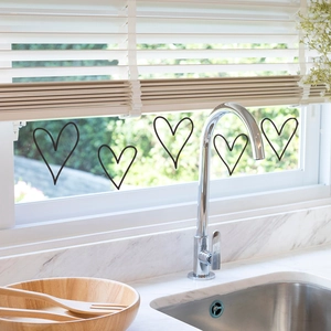 Minimalist hand-drawn heart wall stickers in black line art for home window decoration