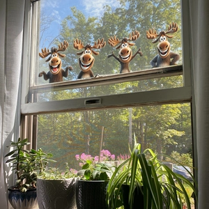 Set of four 3D cartoon reindeer wall stickers with funny expressions for home decor