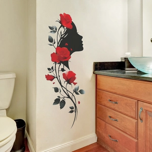 Artistic wall decal featuring a female silhouette with red roses and green leaves