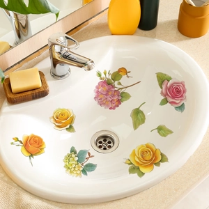Colorful floral adhesive wall decals featuring roses and hydrangeas on a white sink