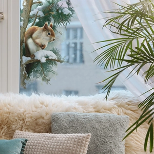 Winter window sticker featuring a realistic squirrel on snow-covered cedar pine branches