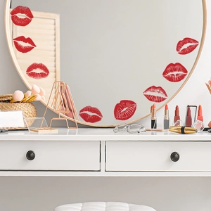 Set of red lip kiss wall decals on a gold-rimmed mirror for bedroom decoration
