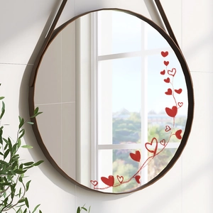 Minimalist round wall mirror with brown frame and red heart pattern on tile wall
