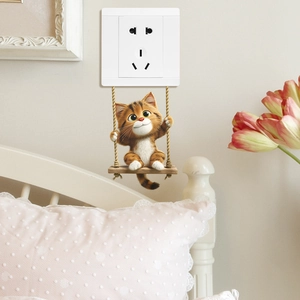 Creative 3D wall sticker of a cute orange cat on a swing near a white power outlet