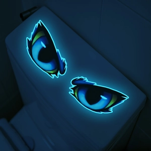 Luminous cat eyes wall decal glowing in the dark on a white surface home decor