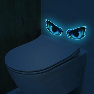 Luminous cartoon monster eyes wall sticker glowing blue-green in dark room decor