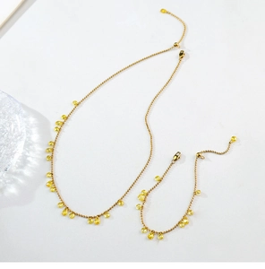 Detail view of gold bead chain with irregular yellow water-drop crystals for necklace and bracelet