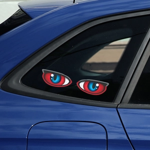 Creative anime style red and blue cat eye car window stickers on a blue vehicle