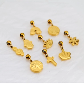 Collection of gold-plated charms including rainbow, crown, and tree of life for DIY jewelry