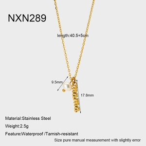 Detailed view of the 18k gold plated mama pendant and pearl on a stainless steel chain