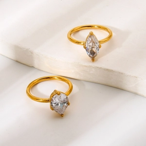 Gold-plated stainless steel ring featuring marquise and pear cut zircon stones on stone steps