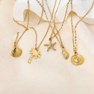 Golden ocean series necklaces featuring starfish shell and palm tree pendants in steel