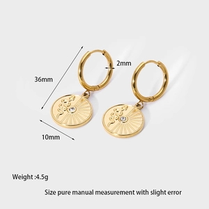 Detailed view of 14k gold plated snake scale drop earrings with crystal and size specs