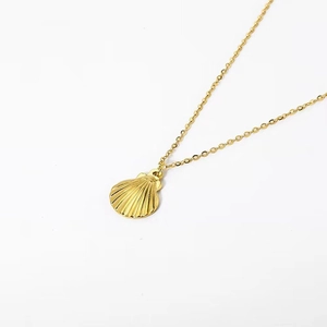 Golden titanium steel necklace featuring a textured seashell pendant for women