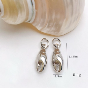 Detailed view of silver shell pendants with dimensions 13.5mm height and 5.5mm width