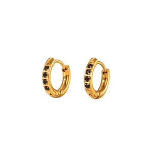 Detail view of 18K gold plated huggie earrings with embedded black zircon stones
