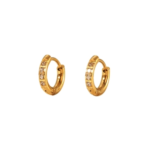 Detailed macro view of 18K PVD gold plated huggie earrings with clear cubic zirconia inlay