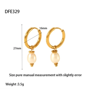 Close-up of gold stainless steel hoop earrings with elegant drop freshwater pearls