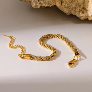 Two-tone braided twist chain bracelet in 18K gold and silver with lobster clasp closure