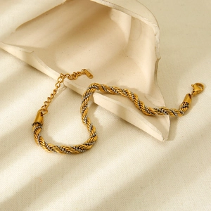 Detail of mixed-tone twisted chain bracelet with lobster clasp and S.STEEL tag