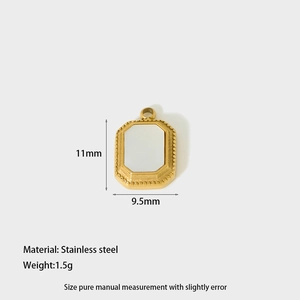 Detail of rectangular stainless steel pendant with white inlay and gold beaded edge