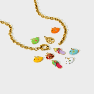 Detailed assortment of colorful enamel fish, ladybug, and slipper charms on a gold chain