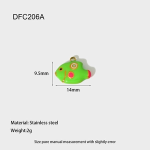 Detailed view of green and pink enamel goldfish charm with stainless steel base