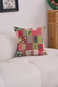 Detail of Christmas throw pillow with reindeer and snowflake jacquard patchwork texture