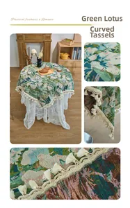 Detail of green lotus jacquard tablecloth with elegant curved tassel edge and fringe