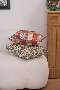 Detail of Christmas jacquard cushion covers with gingerbread and reindeer festive motifs
