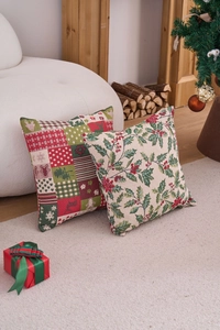 Detail of Christmas throw pillow covers with reindeer and holly leaf festive patterns