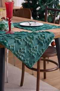 Detail of green Christmas table runner with 3D flocked trees and gold embroidery