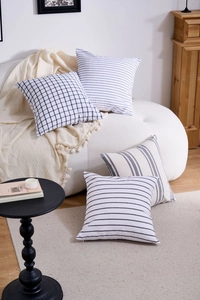 Macro view of geometric pillow covers in textured cotton-linen blend fabric