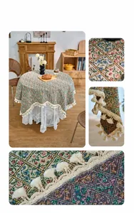 Macro detail of vintage floral jacquard fabric with elegant cream tassels for table decor
