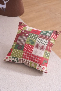 Macro detail of Christmas patchwork pillowcase with reindeer and snowflake jacquard texture