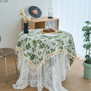 Vintage floral round tablecloth with green iris patterns, cream tassels and layered lace
