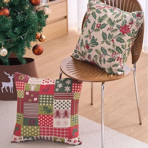 Festive Christmas cushion covers with reindeer and floral patterns on a wooden chair