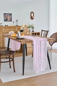 Detailed close-up of pink lace table runner with 3D butterfly and pearl embroidery