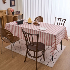 Linen cotton rectangular tablecloth with red and white stripes in a cozy dining setting